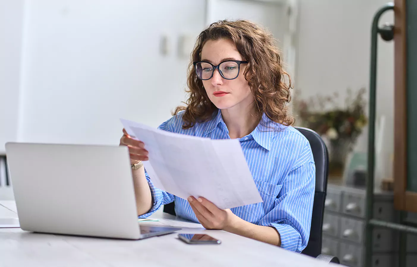 A woman looking at papers
